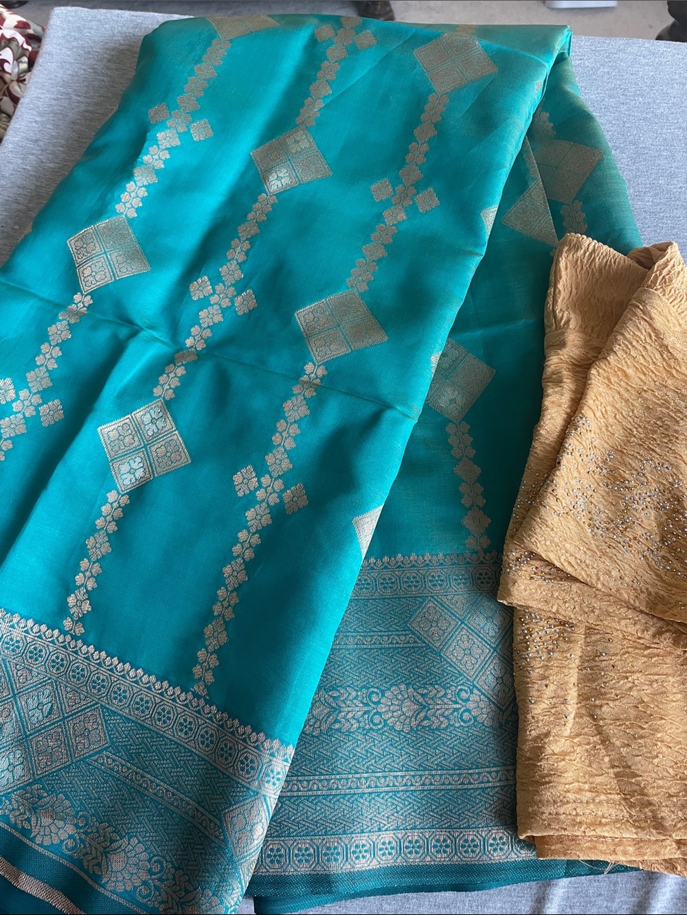 Elegant green color Saree with gold color blouse